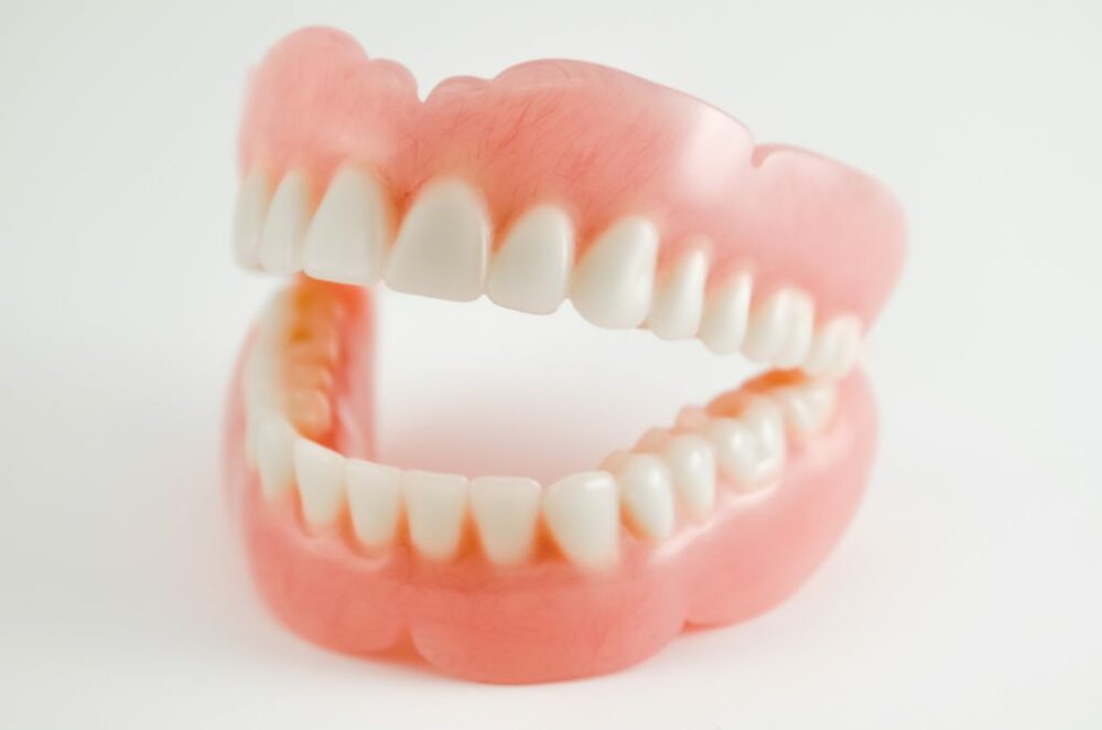 do dentures stop teeth from shifting